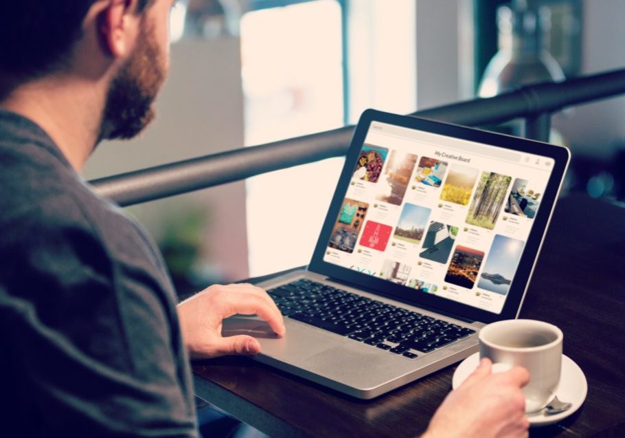 Man looking at stock images on computer