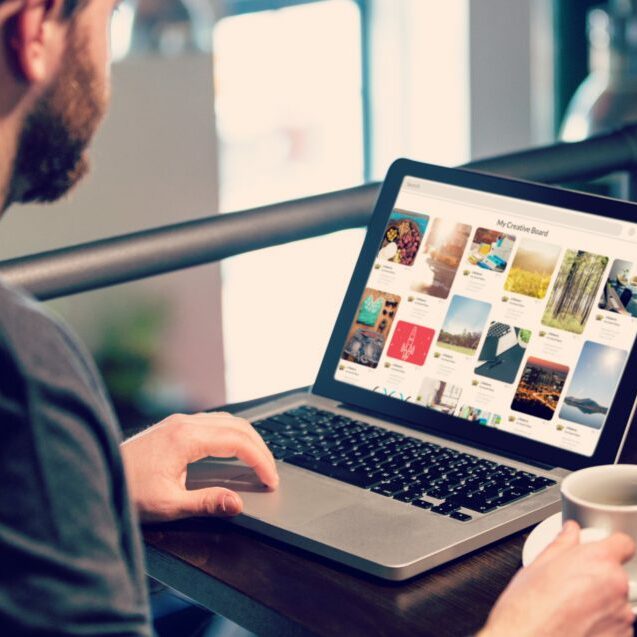 Man looking at stock images on computer