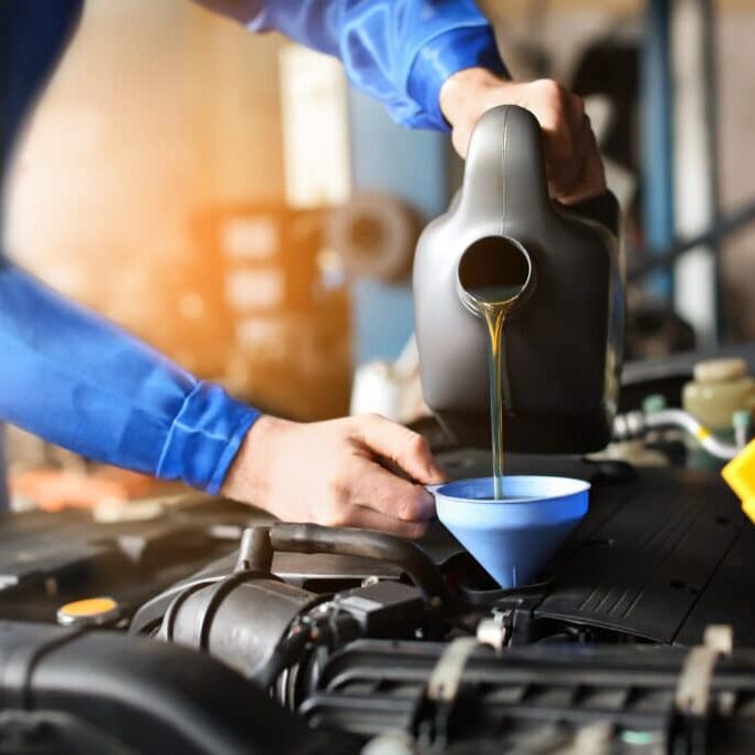 Mechanic filling car with oil to indicate the importance of e-commerce website care