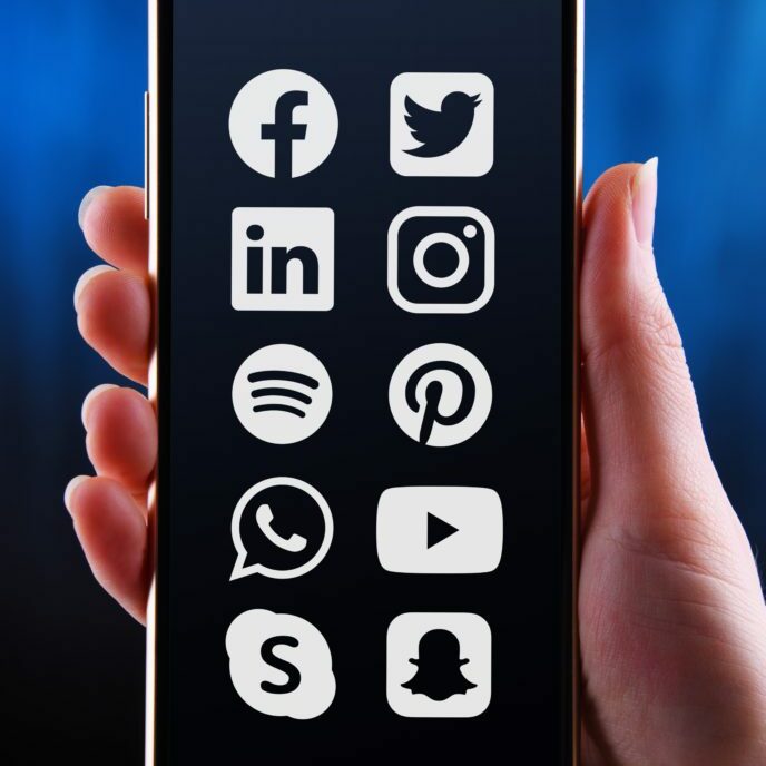 Variety of social media platform icons displayed on phone screen