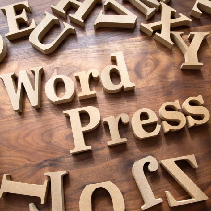 Letter blocks arranged to say WordPress - image for why choose wordpress